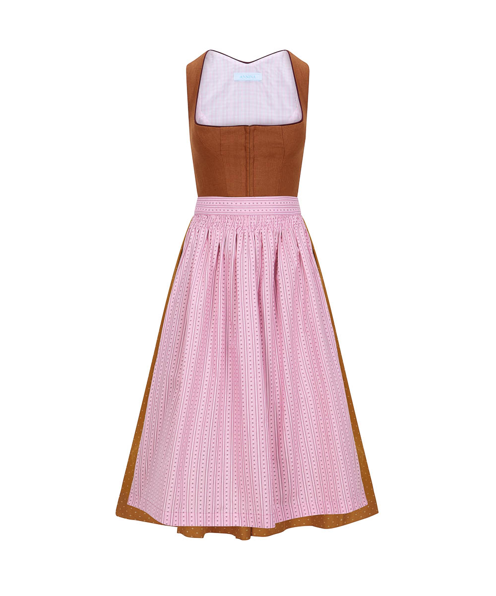 Dirndl „ Olivia“ mit einem Oberteil aus Leinen, safrangelbem Baumwollrock und pastellrosa Schürze.